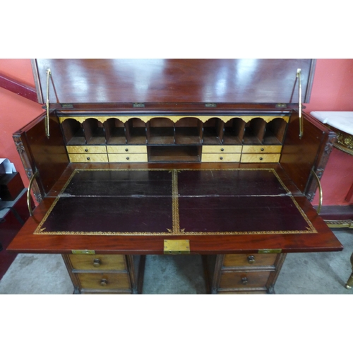 7 - A Victorian mahogany secretaire kneehole desk