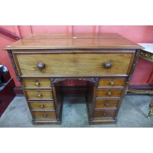 7 - A Victorian mahogany secretaire kneehole desk