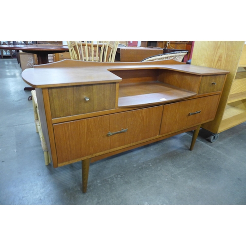 73 - A small teak sideboard