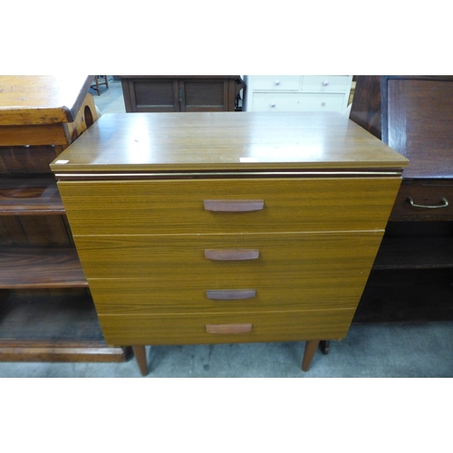 75 - A teak chest of drawers