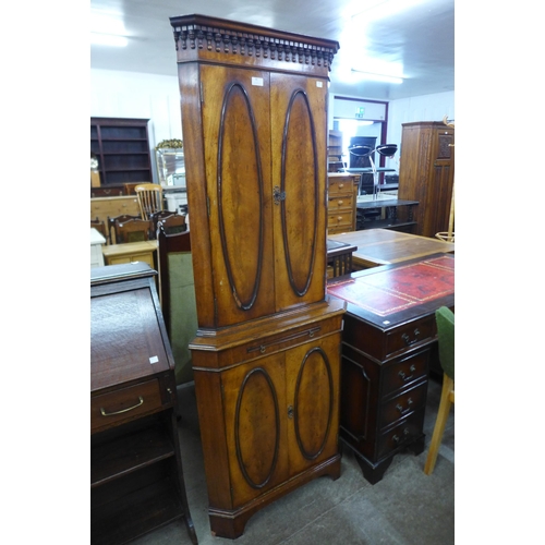 88 - A mahogany freestanding corner cocktail cabinet