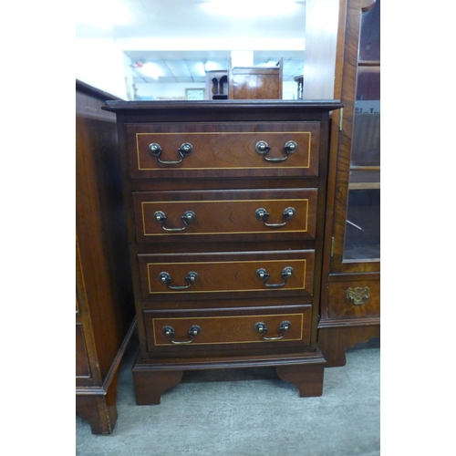 101 - A small inlaid mahogany chest of drawers