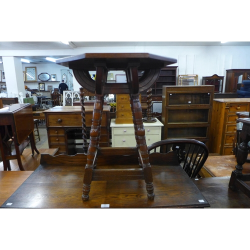 108 - An Arts and Crafts oak octagonal occasional table, manner of Bruce Talbert