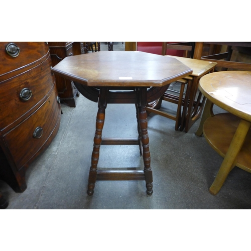 108 - An Arts and Crafts oak octagonal occasional table, manner of Bruce Talbert