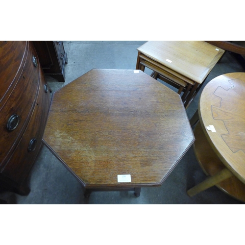 108 - An Arts and Crafts oak octagonal occasional table, manner of Bruce Talbert