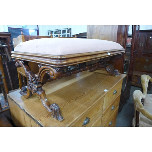 114 - An early Victorian carved walnut and fabric upholstered x-frame stool