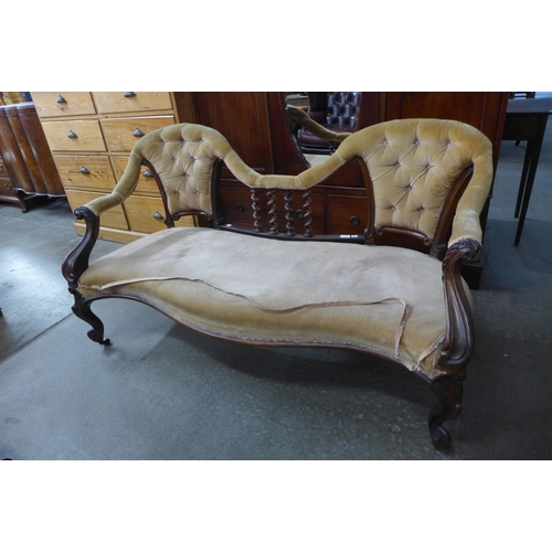 116 - An early Victorian carved rosewood and fabric upholstered settee