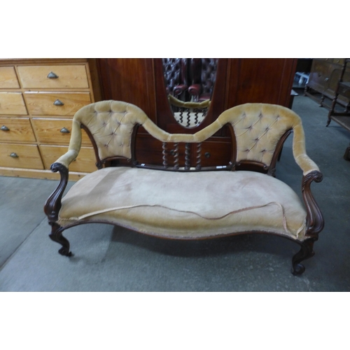 116 - An early Victorian carved rosewood and fabric upholstered settee