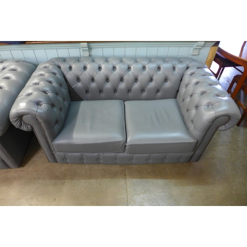 117 - A grey leather Chesterfield settee