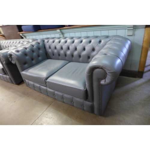 117 - A grey leather Chesterfield settee