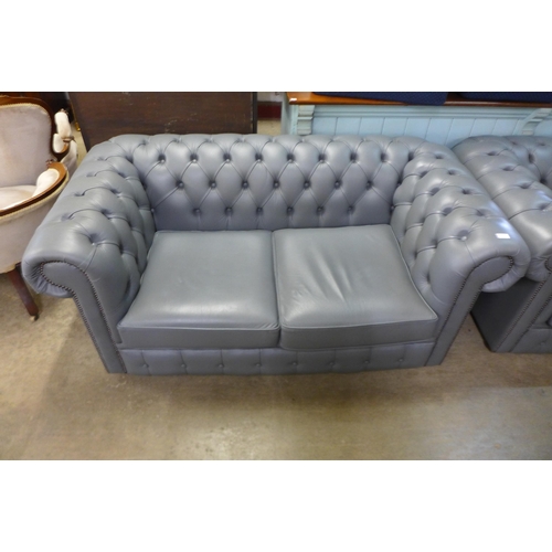 118 - A grey leather Chesterfield settee