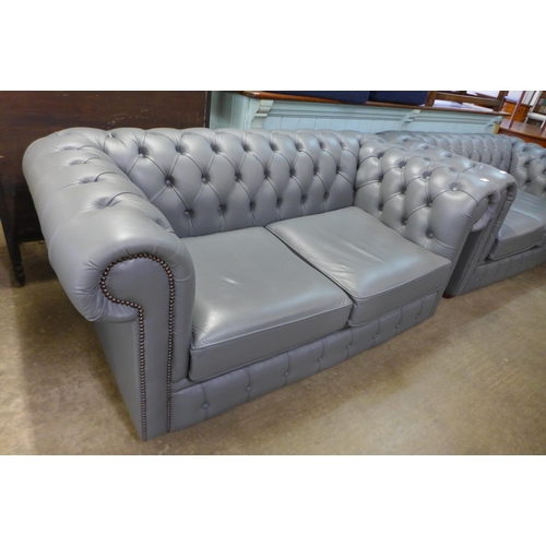 118 - A grey leather Chesterfield settee