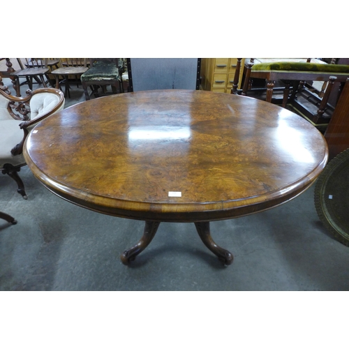 120 - A Victorian figured walnut oval tilt-top breakfast table