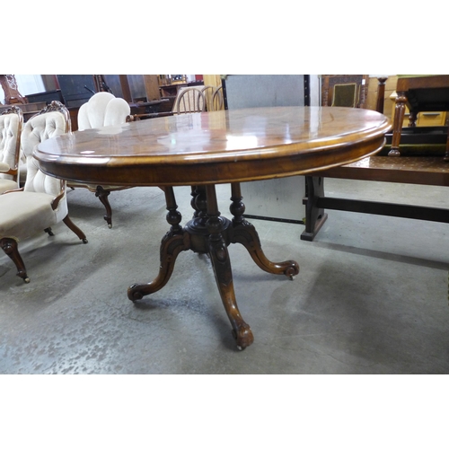 120 - A Victorian figured walnut oval tilt-top breakfast table