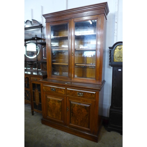 128 - A Victorian walnut and burr walnut bookcase