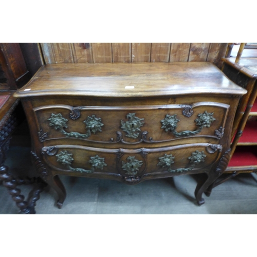 133 - An 18th Century style French provincial fruitwood bombe shaped commode