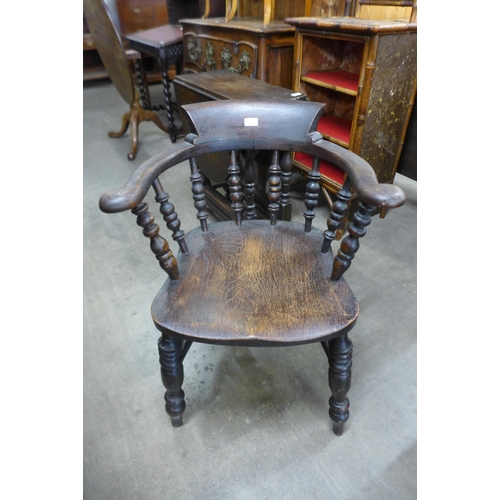 136 - A Victorian elm and beech smokers bow chair