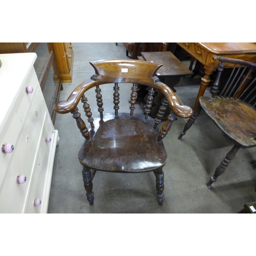 144 - A Victorian elm and beech smokers bow chair