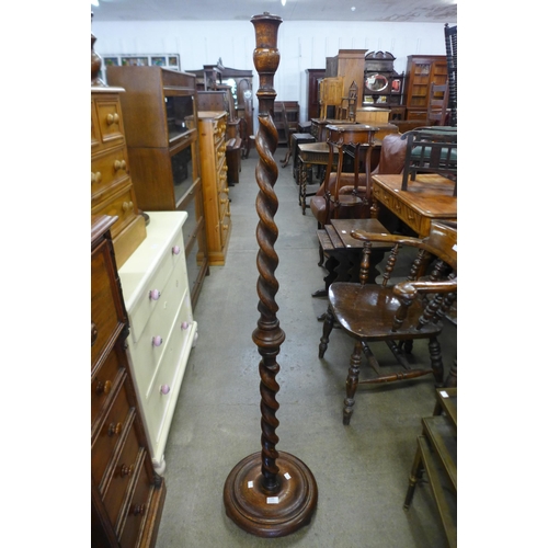 146 - An oak barleytwist standard lamp