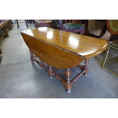 158 - An Ercol Golden Dawn ash gateleg coffee table