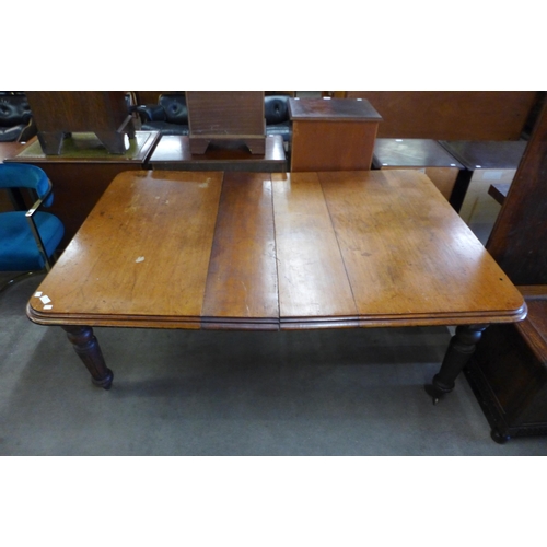 160 - A Victorian mahogany extending dining table