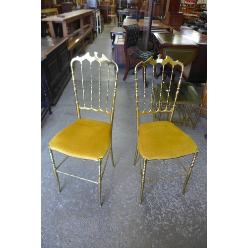 165 - A pair of Italian brass opera chairs