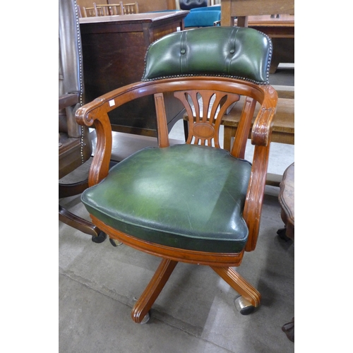 208 - A beech and green leather desk chair