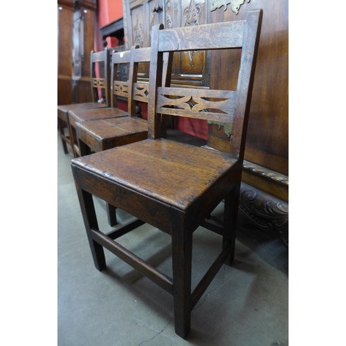 21 - A set of four George III oak chairs