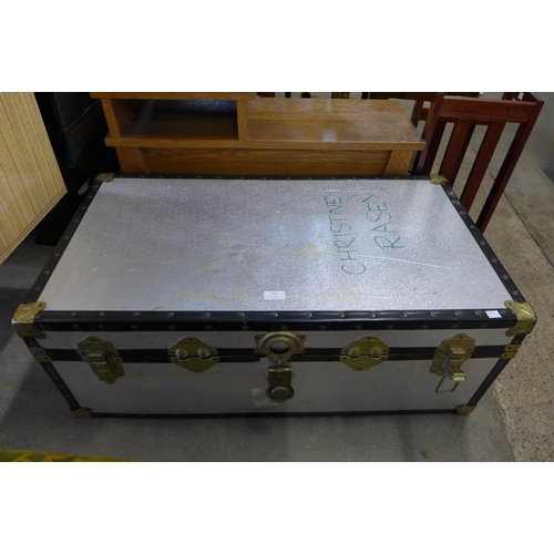 231 - An aluminium banded travel trunk