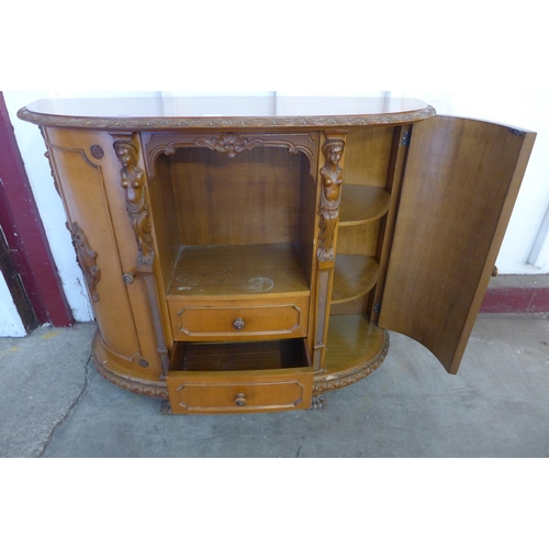 234 - A French style carved walnut demi lune side cabinet