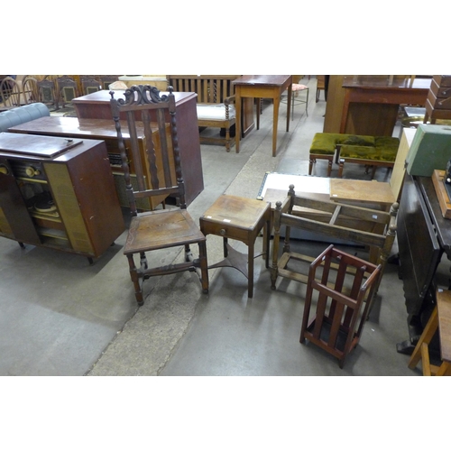 244 - An oak telephone table, two stick stands, oak hall chair and one other