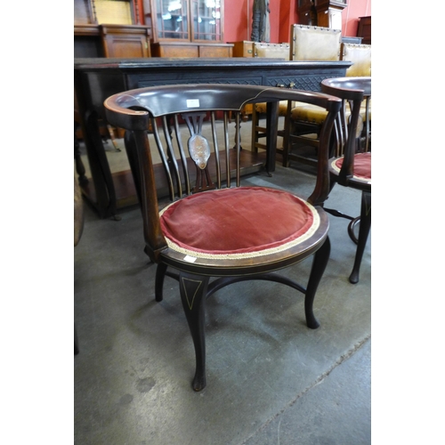 27 - A pair of Edward VII inlaid mahogany tub chairs