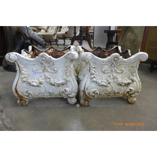 282 - A pair of Victorian style painted cast iron garden planters