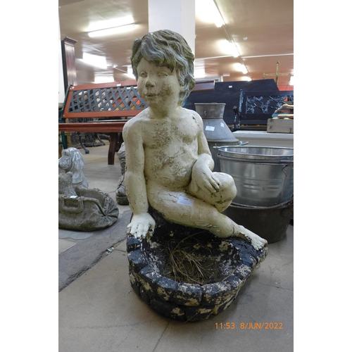 288 - A figural cherub concrete bird bath