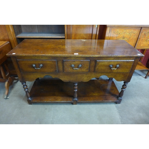 29 - A George III style oak dresser