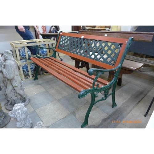 290 - A cast iron ended garden bench