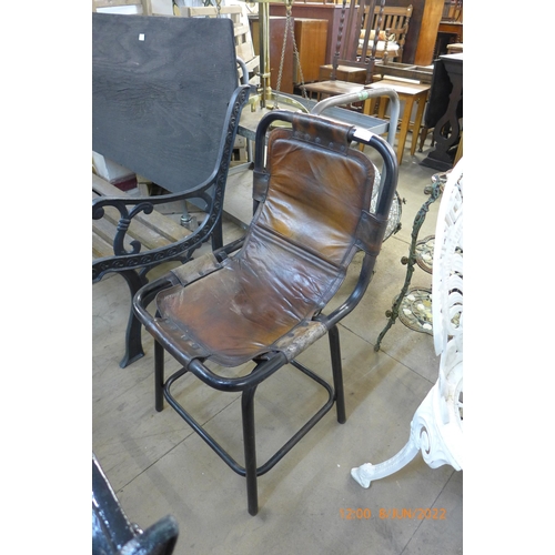 293 - An industrial style steel and leather chair