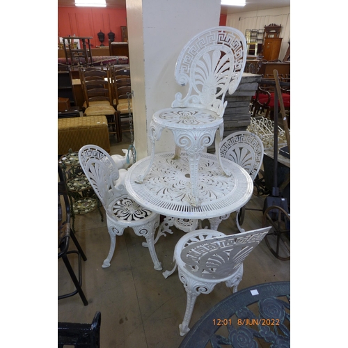 294 - A painted cast alloy garden table and four chairs