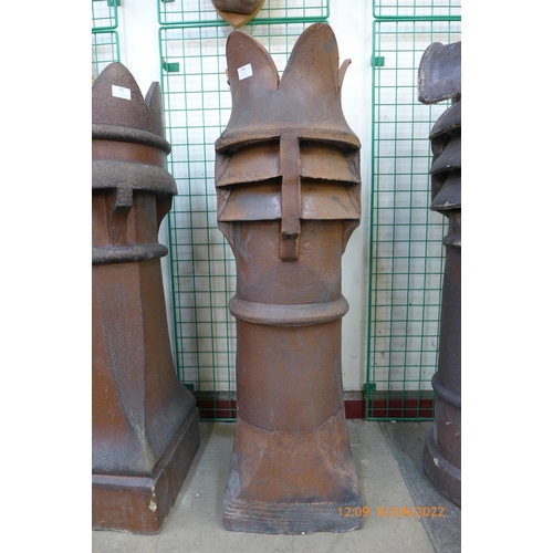 300 - A Victorian terracotta crown glazed chimney pot