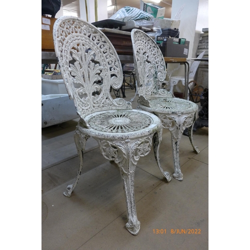 303 - A pair of painted alloy garden chairs