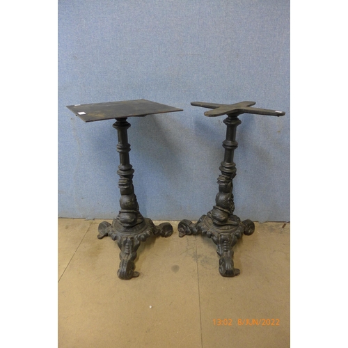 304 - Two cast iron pub table base's