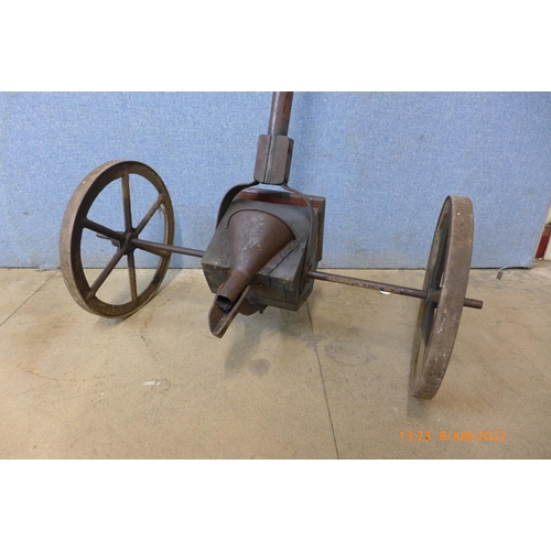 311 - An early 20th century cast iron and pine seeder