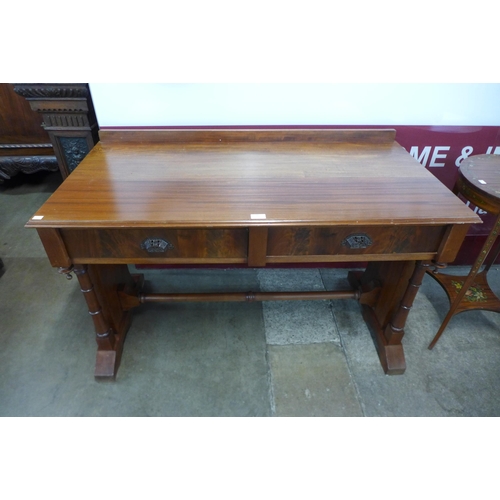 34 - A Victorian mahogany two drawer writing table