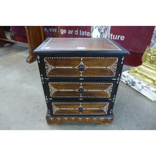 36 - An Anglo Indian hardwood and mother of pearl inlaid three drawer table top cabinet