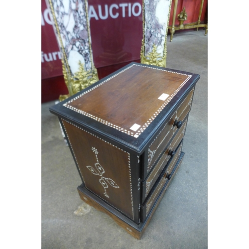 36 - An Anglo Indian hardwood and mother of pearl inlaid three drawer table top cabinet