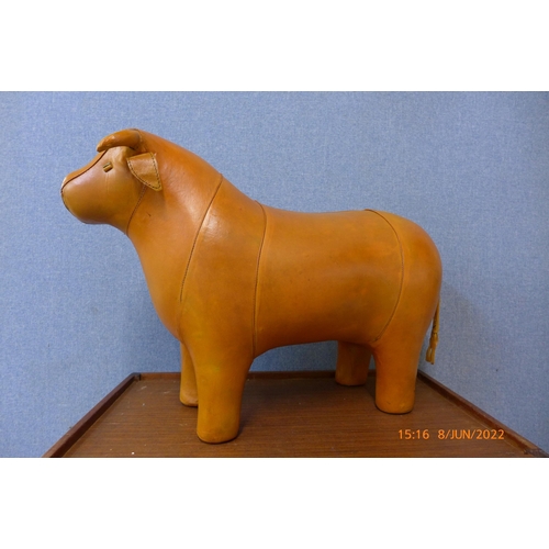 393 - A Liberty & Co. style brown leather bull shaped footstool