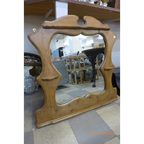 395 - A French style pine framed mirror