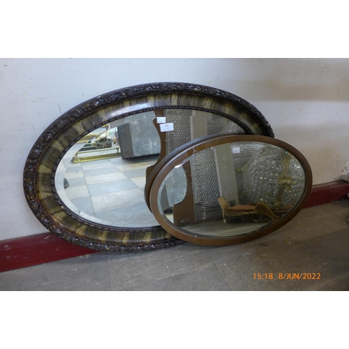 396 - A mahogany oval framed mirror and one other