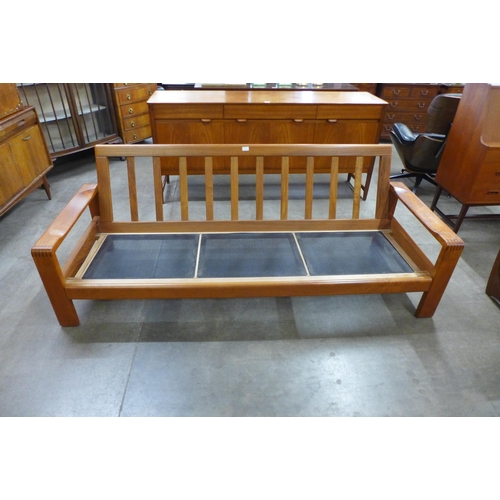 49 - A Danish Bramin teak settee, designed by by Henry Walter Klein