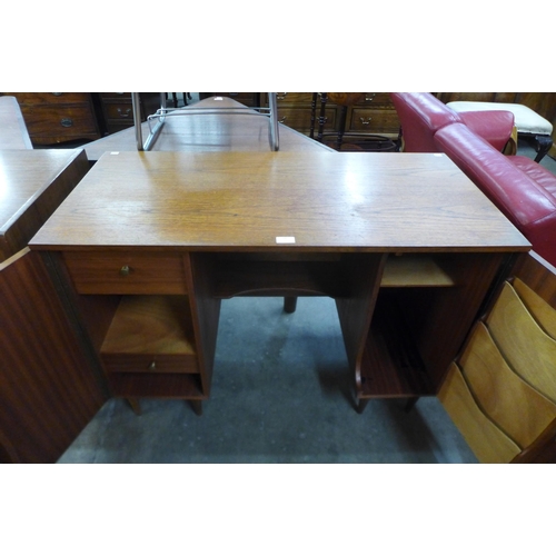 66 - A teak metamorphic home office desk